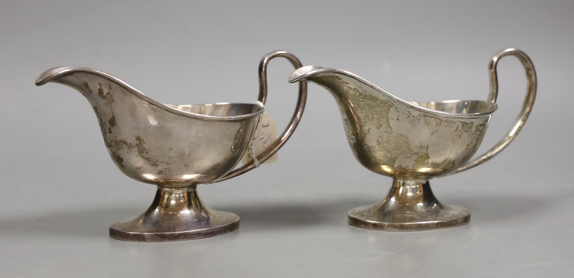 A pair of George V silver pedestal sauceboats, William Hutton & Sons, Sheffield, 1916, 11.4oz.